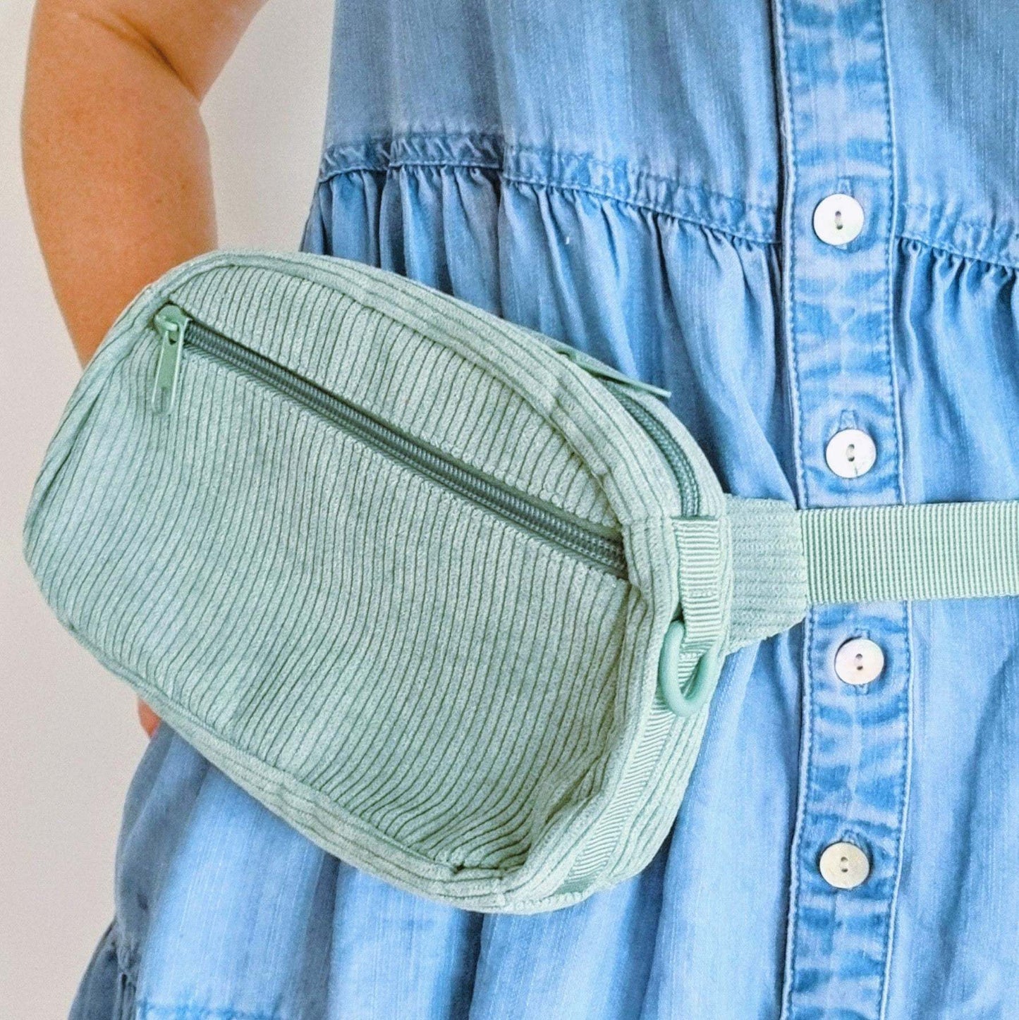 Green dog walking bag around waist 
